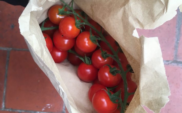 A bag of cherry tomatoes
