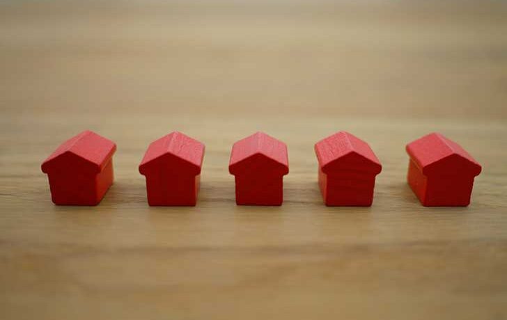 Row of toy houses all the same